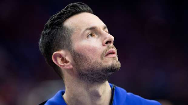 Former NBA player JJ Redick looks up.